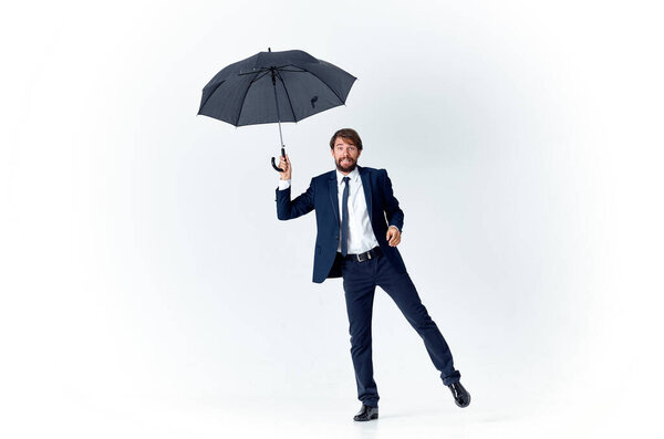 man in suit with umbrella weather protection from rain