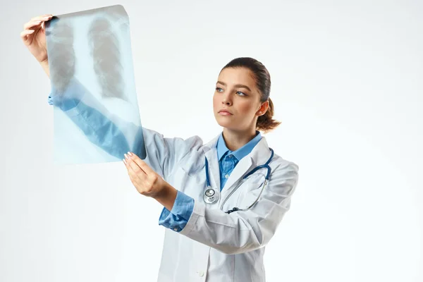 Female doctor in white coat medicine x-ray examination Royalty Free Stock Images