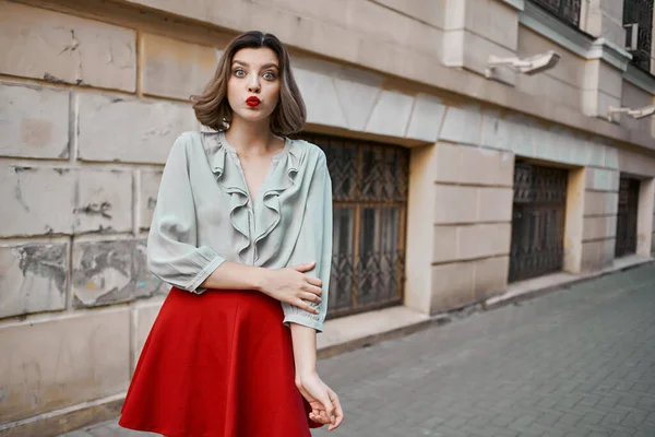 Woman outdoors in red skirt outdoors lifestyle — Stock Photo, Image