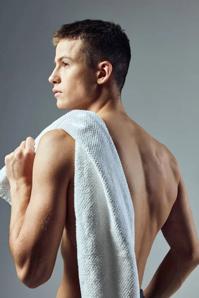 Handsome man with towel on shoulders nude torso isolated background — Fotografia de Stock