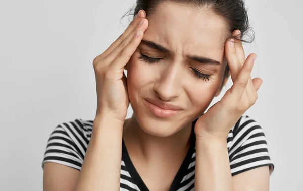 woman with headache depression migraine negative close-up