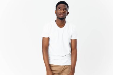 Afrikaans man white T-shirt on a Light background Copy Space 