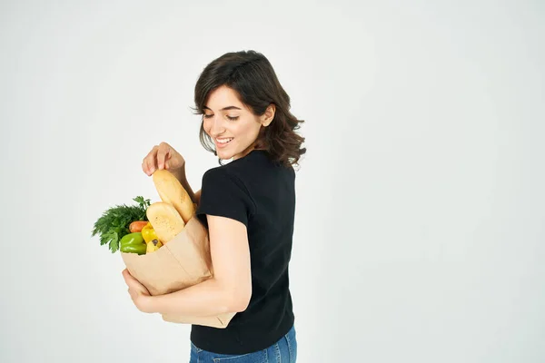 brunette with grocery package delivery shopping