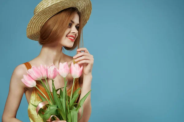 smiling women with bouquet of flowers in hat spring holiday