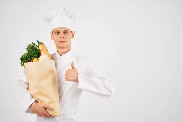 Chef con pacchetto cibo cucina cibo sano — Foto Stock