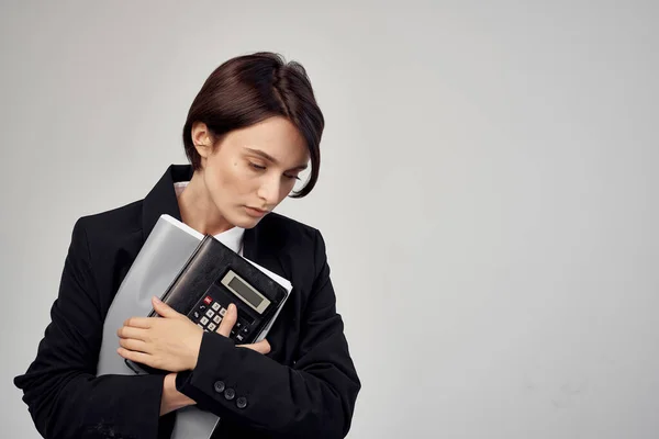 woman in black jacket documents Professional office manager