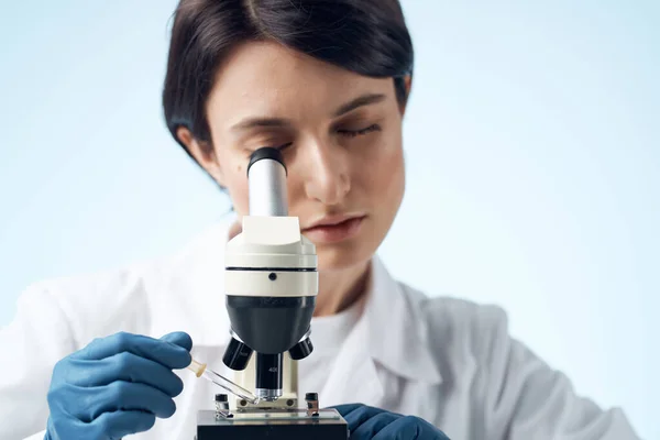 woman laboratory assistant microscope diagnostics research science