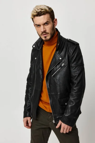 Guy blond leather jacket and orange sweater fashion style — Stock Photo, Image