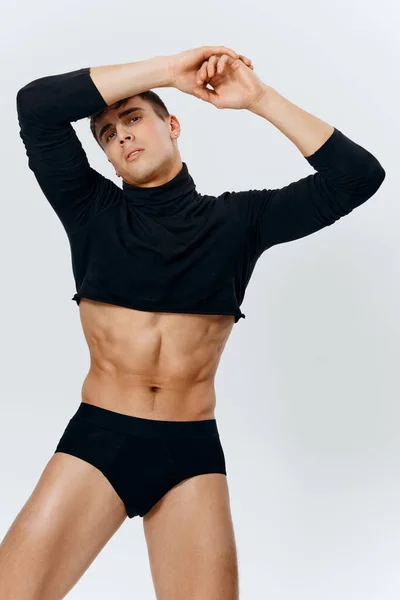 Sexy guy with a pumped up torso and cubes on the belly bodybuilder panties sweater model — Stock Photo, Image