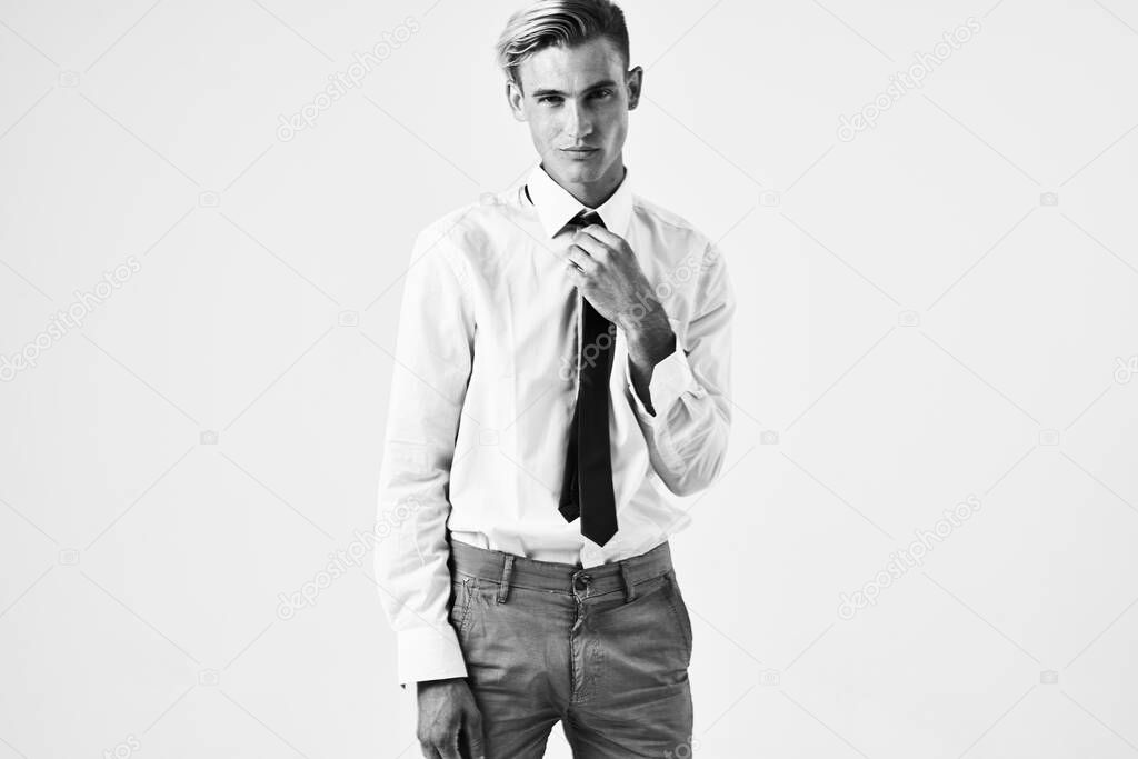 man in white shirt with tie fashionable hairstyle posing 