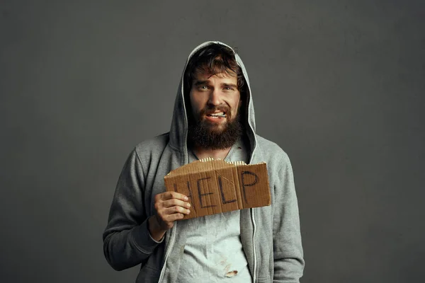 homeless bearded man asking for money