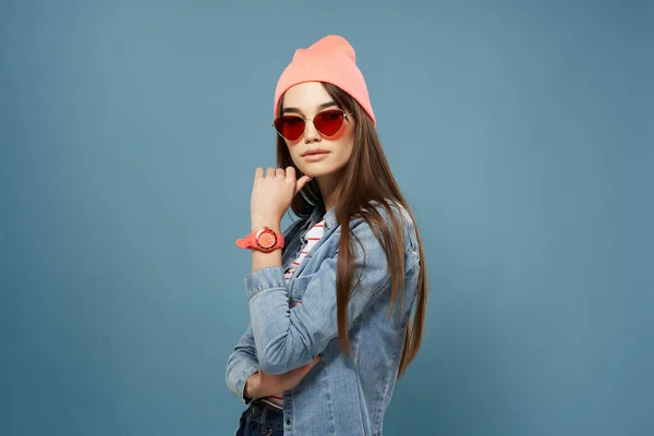 Pretty woman in denim jacket pink hat glasses fashion modern style — Stock Photo, Image