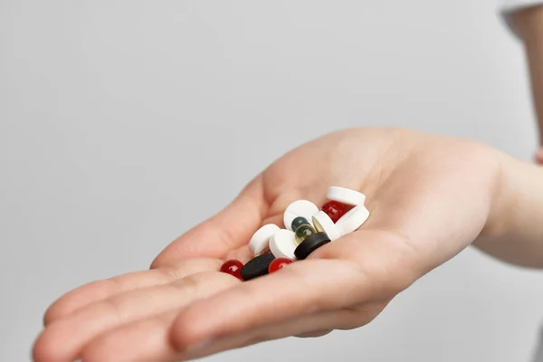 Pills in the palm of the hand medicine medications health pain reliever — Stock Photo, Image