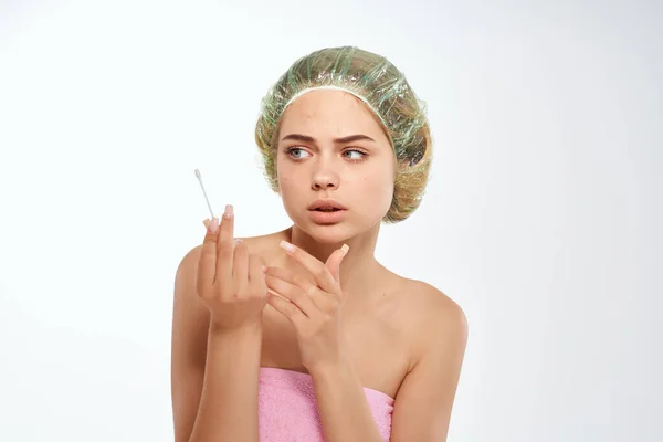 Woman with bare shoulders clean skin pink towel face care — Stock Photo, Image