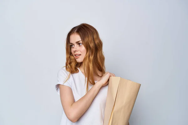 Woman with a package of groceries shopping packaging shopping — Stock Photo, Image