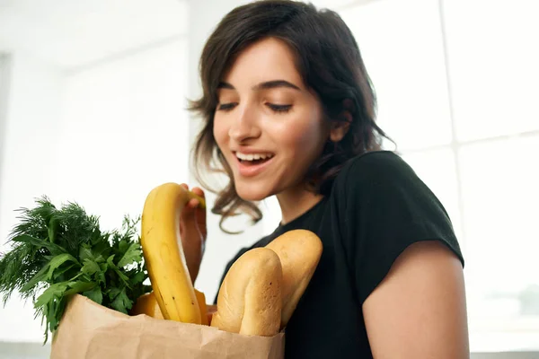 Cheerful woman food bag vegetables cooking health — Stock Photo, Image