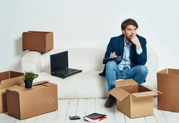 business man packing things  in office moving