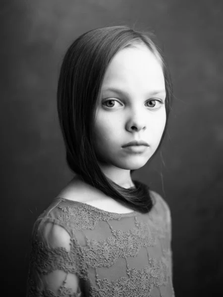 Little girl posing long hair close-up black and white photo — Stock Photo, Image