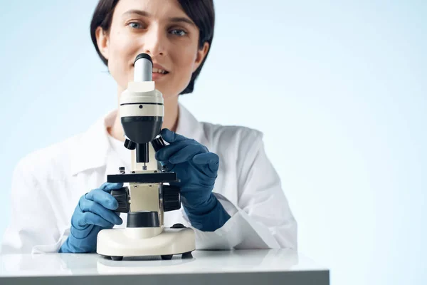 woman laboratory assistant microscope diagnostics research science