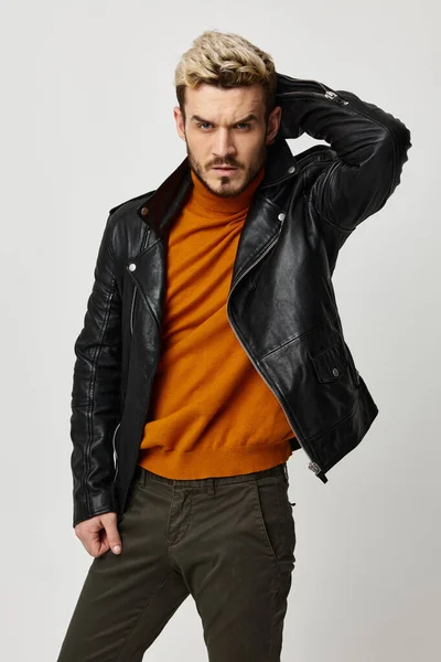 sexy man in leather jacket posing