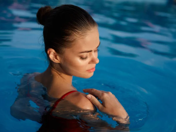 Woman in swimsuit nature closed eyes pool luxury — стоковое фото