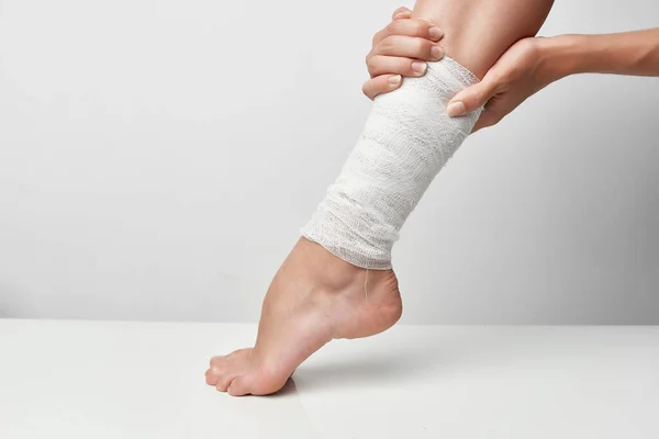 Health problems bandaged leg traumatology close-up — Stock Photo, Image