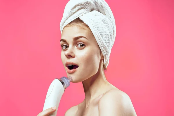 Woman with towel on head naked shoulders facial massage — Stock Photo, Image