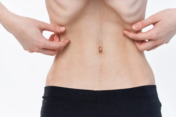 Женщина с проблемами со здоровьем плоского желудка анорексия потеря веса — стоковое фото