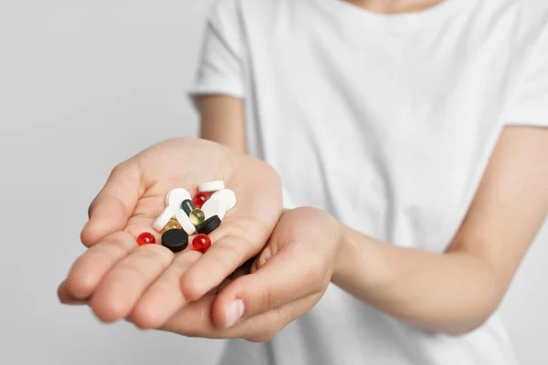 Pills in the palm of the hand medicine medications health pain reliever — Stock Photo, Image