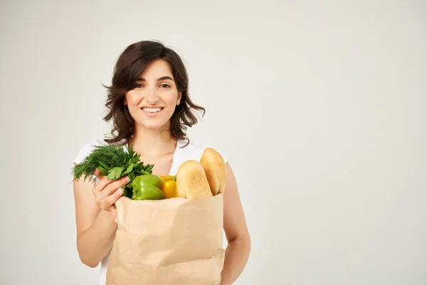 woman with food package healthy food vegetables supermarket