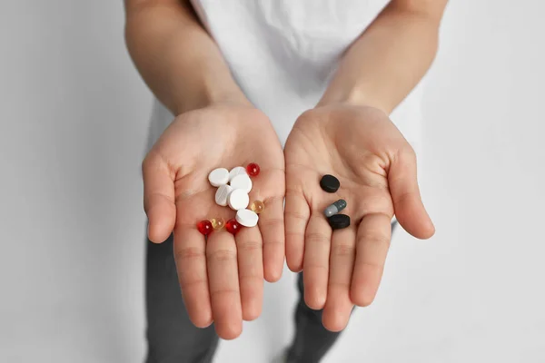 Multicolored pills on palms close-up treatment medicine health — Stock Photo, Image