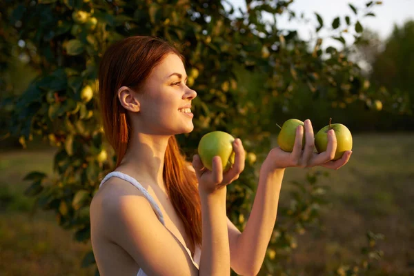 Cheerful woman outdoors near apple tree fresh air fruits — Stock Photo, Image