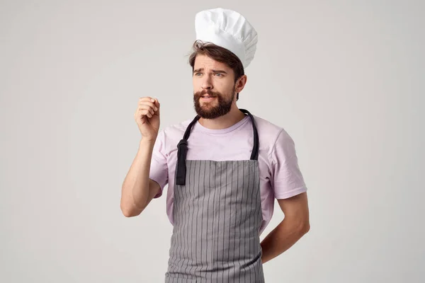 Vousatý muž v kuchařské uniformě profesionální potravinářský průmysl — Stock fotografie