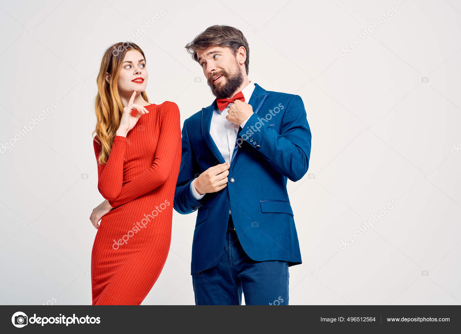 Un hombre en un traje al lado de una mujer en un vestido rojo de la familia atractiva luz de fondo: fotografía de stock © ShotStudio #496512564 | Depositphotos Un hombre en un traje al lado de una mujer en un vestido rojo de la familia atractiva luz de fondo: fotografía de stock © ShotStudio #496512564 | Depositphotos