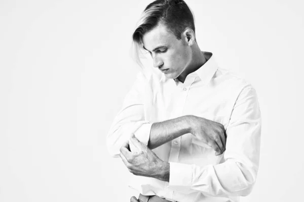 Man guides the sleeve of white shirt model posing studio — Stock Photo, Image