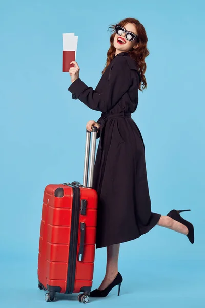 Business woman with luggage passports plane tickets travel