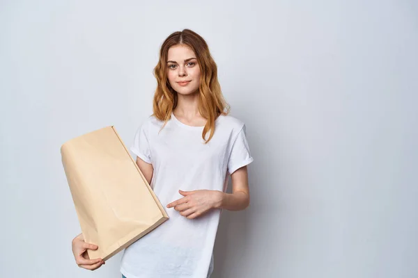 Pretty woman with package of groceries shopping delivery lifestyle — Stock Photo, Image