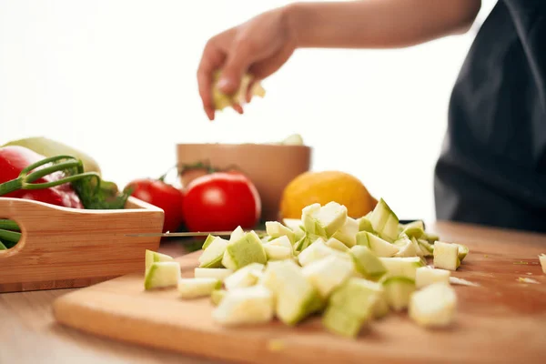 cutting vegetables on a cutting board kitchen close-up fresh