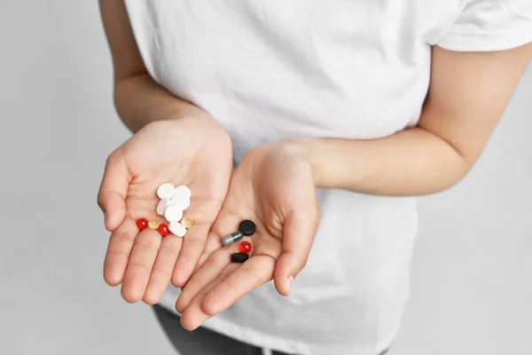 Woman with pill in hands treatment health medicine health problems — Stock Photo, Image