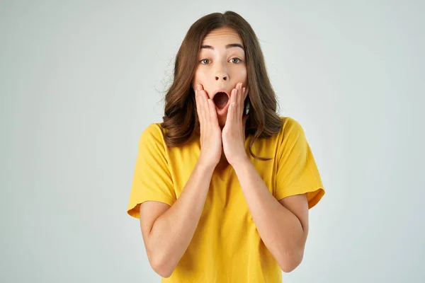 surprised woman holding face but emotions upset