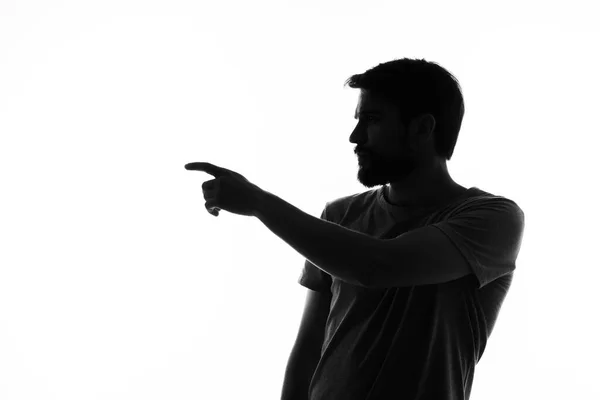 Man gesturing with his hands silhouette light background anonymity — Stock Photo, Image