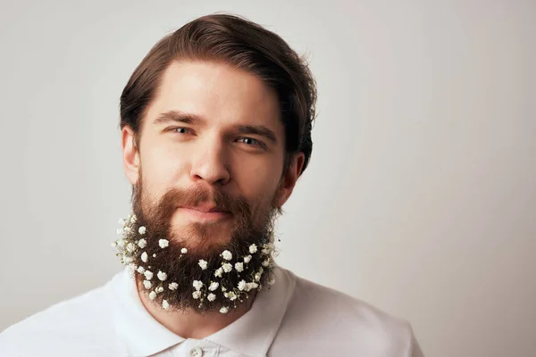 Cheerful man flowers in a beard decoration emotions white t-shirt