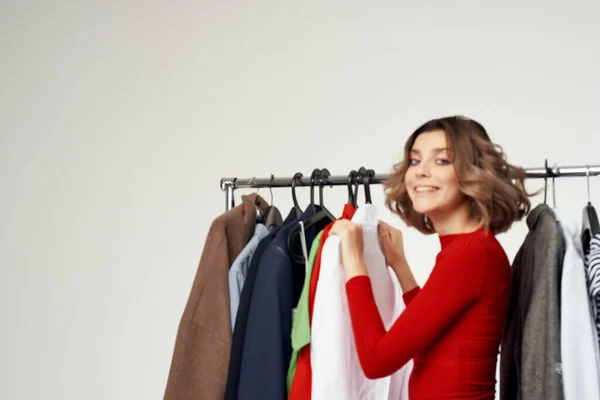 pretty woman trying on clothes shop shopaholic isolated background