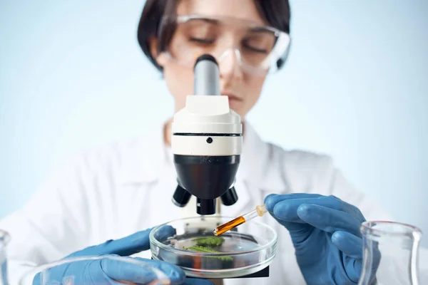 woman scientist microscope diagnostics research technology
