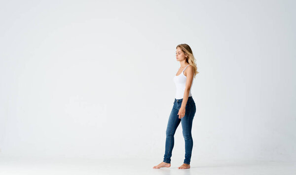 woman in jeans barefoot Positive light motion background