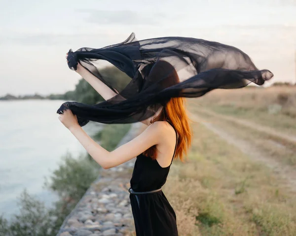 Red-haired woman black veil nature posing — Stock Photo, Image