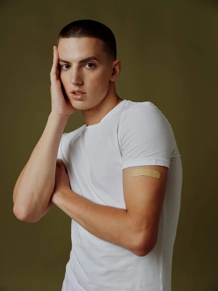 Young man with adhesive plaster on his shoulder immunity health vaccine passport injection — Stock Photo, Image