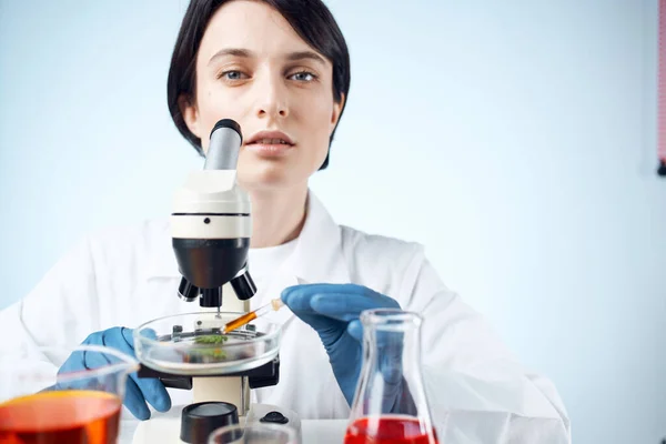 woman laboratory assistant microscope research diagnostics science work