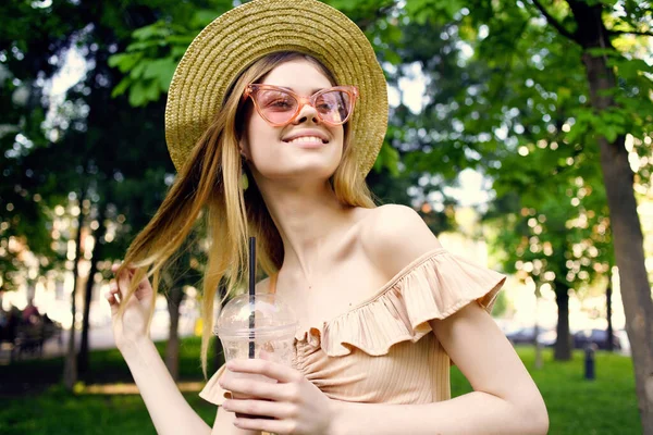 Cheerful woman outdoors in the park walk summer fashion — Stock Photo, Image