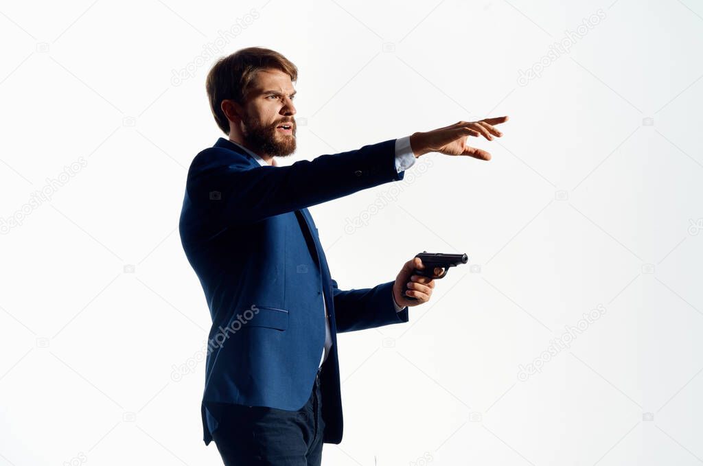 businessmen gun in the hands of the mafia emotions Agent posing studio